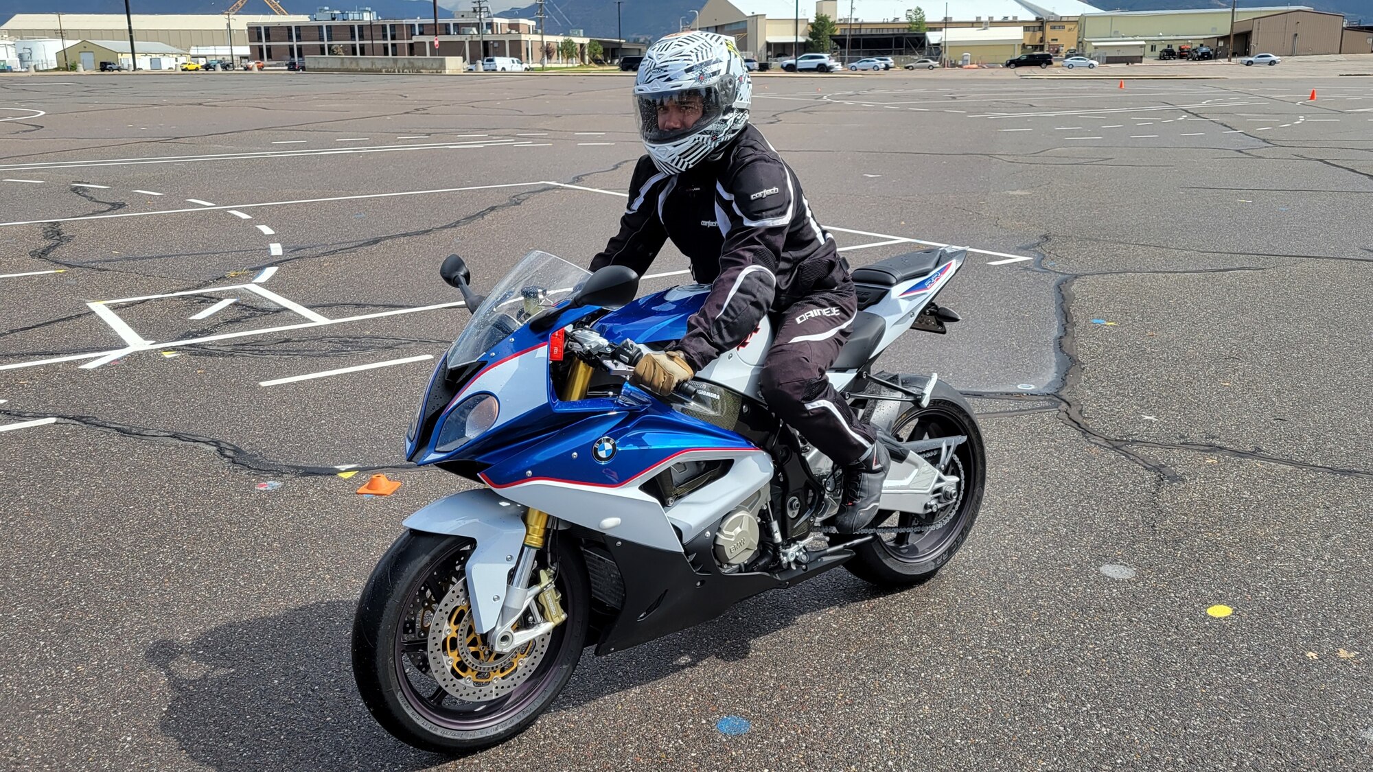 Staff Sgt. Russell Poulsen riding on a motorcycle.