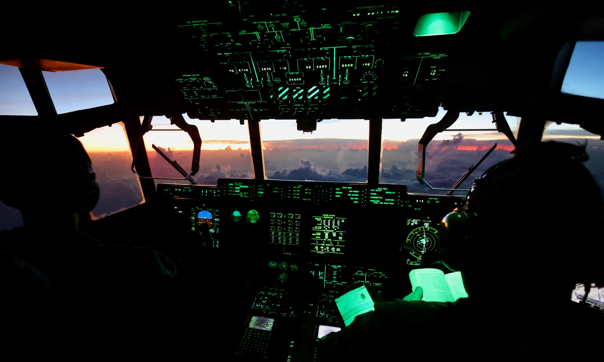 Pilots fly into tropical storm system, image showing sunset out of cockpit window.