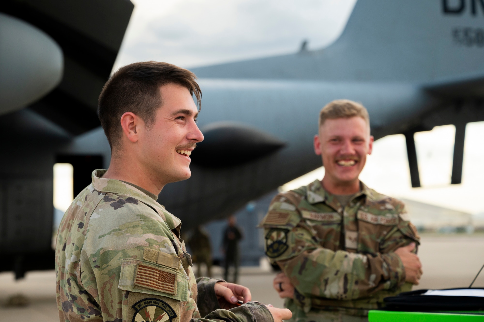 Photo of maintainers by EC-130H aircraft.