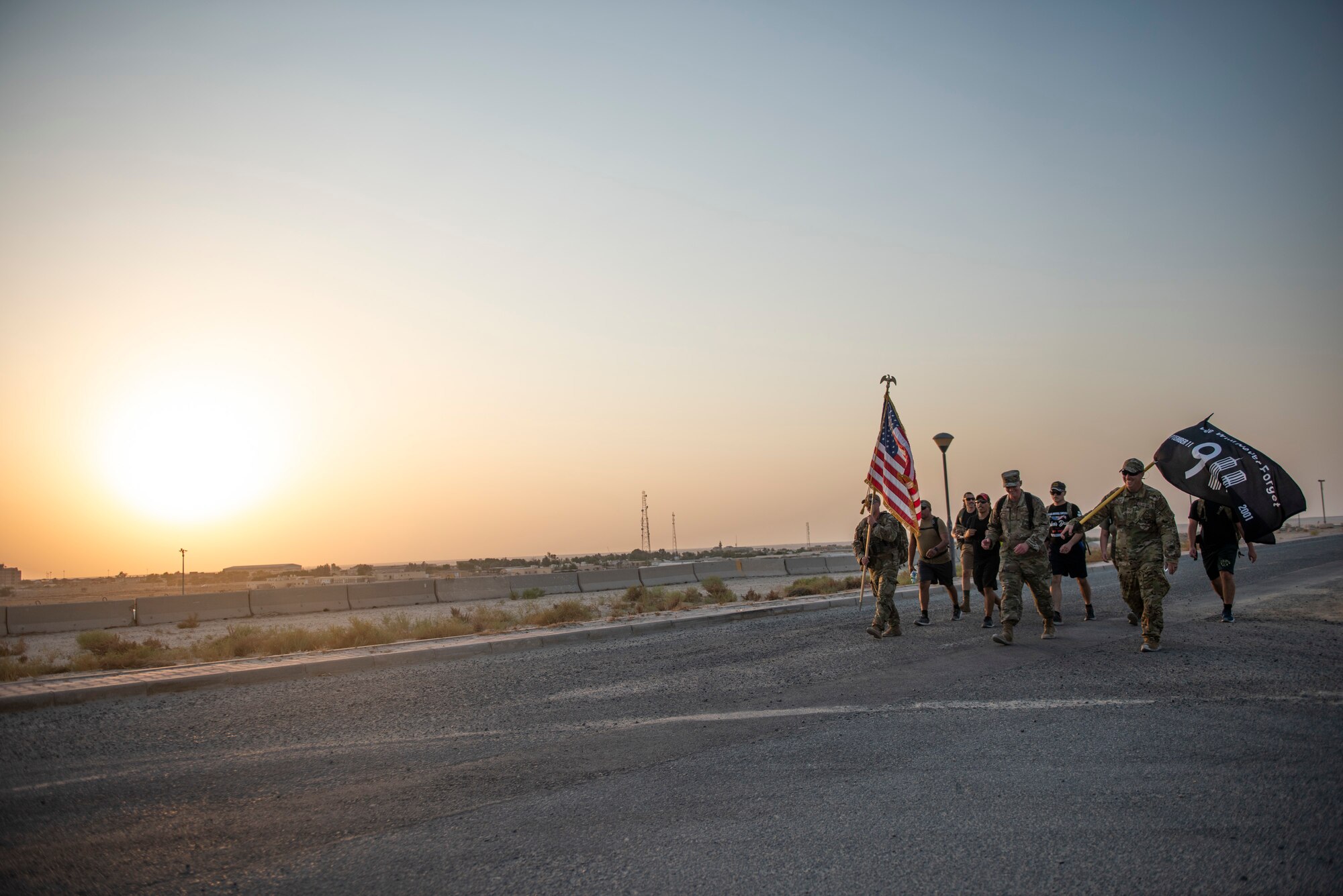 Members from the 386 Air Expeditionary Wing march throughout the evening at Ali Al Salem Air Base, Kuwaiti, 11 Sept. 2022 in remembrance of those lost on Sept. 11, 2001. Members from multiple branches of service and coalition teammates from throughout the world took part in the 24-hour march. (U.S. Air Force photo by Senior Master Sgt. David Salanitri)