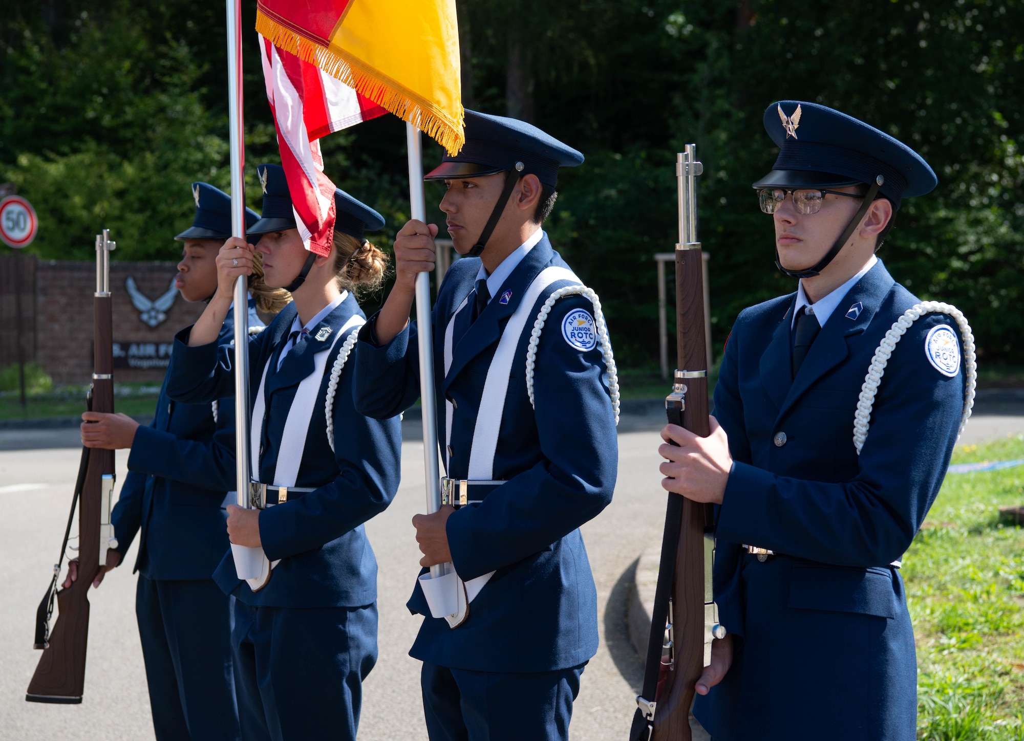 Kaiserslautern High School Honor Guard members conduct the presentation of the colors at a the Father Emil Kapaun Traffic Circle Dedication at Kapaun Air Station, Germany, Sept. 12, 2022.