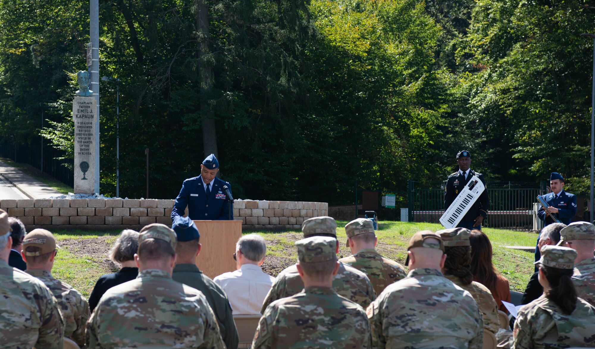 Capt. Thomas Simmons, 86th Airlift Wing chaplain, addresses the audience during the Father Emil Kapaun Traffic Circle Dedication ceremony at Kapaun Air Station, Germany, Sept. 12, 2022.