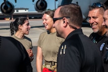 U.S. Air Force Airmen from the 15th and 16th Airlift Squadrons and personnel from the North Charleston Police Department, discuss training at Joint Base Charleston, South Carolina, Sept.16, 2022. In an effort to strengthen joint efforts, the NCPD provided two Mine Resistant Ambush Protected Vehicles, or MRAPs, for loadmasters to practice loading onto a C-17 Globemaster III aircraft. (U.S. Air Force photo by Airman 1st Class Christian Silvera)