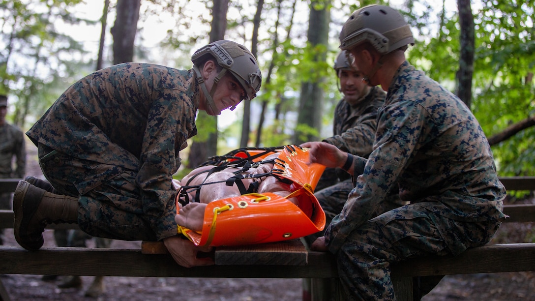 U.S. Marines with 2d Marine Division transport a simulated casualty during a leader's reaction course as part of the Division Leader Assessment Program 4-22 on Fort A.P. Hill, Virginia, Sept. 13, 2022. The assessment program provides Marines with learning and mentorship opportunities, which helps train and develop Marines that demonstrate an apex level of lethality, endurance and comprehensive warfighting ability. (U.S. Marine Corps photo by Lance Cpl. Ryan Ramsammy)