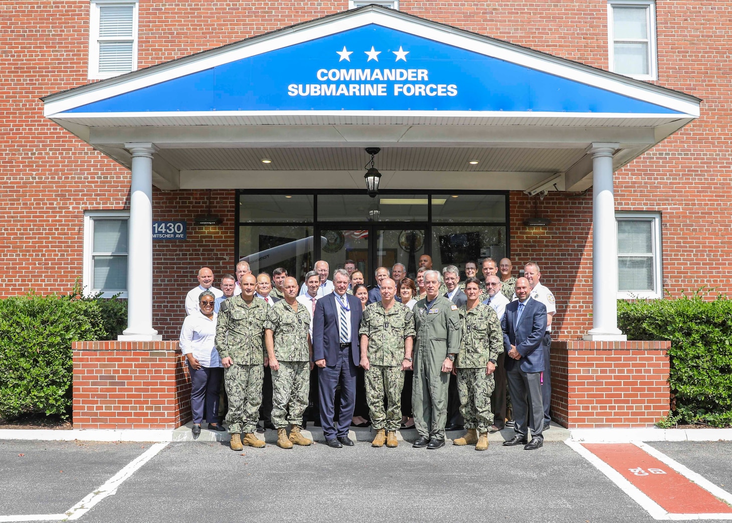 Participants from 17 commands and installations pose for a photo during a regional and area commander summit hosted by Submarine Force Atlantic onboard Naval Support Activity Hampton Roads, Thursday, Sept. 15, 2022.