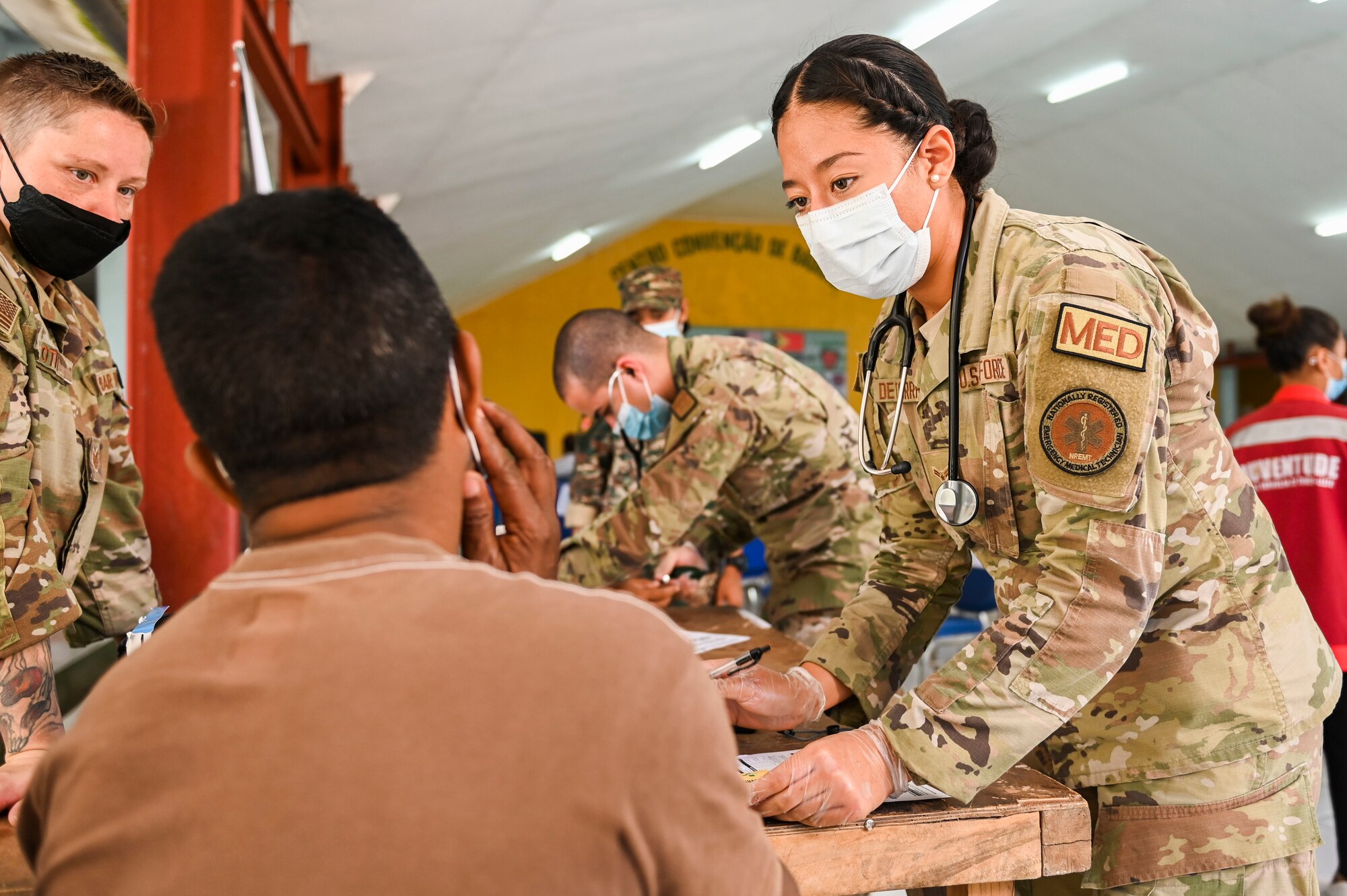 Image of an Airman helping a patient.