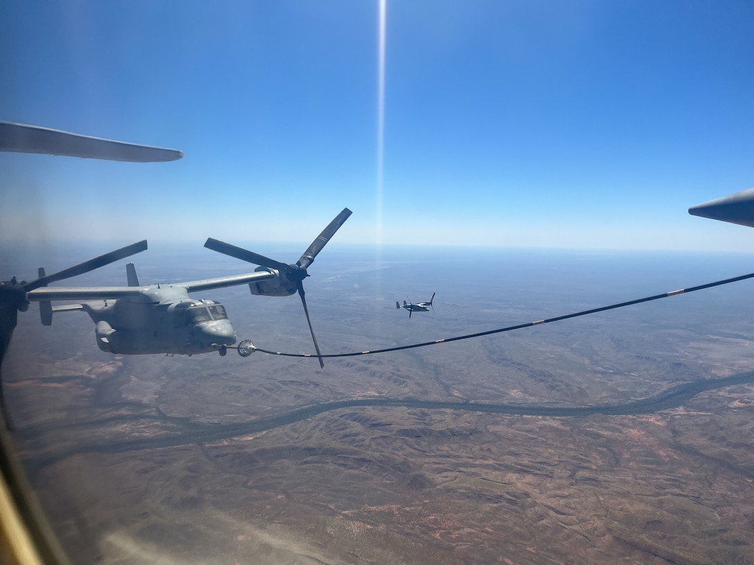A U.S. Marine Corps MV-22 Osprey from Marine Medium Tiltrotor Squadron 268 Reinforced, Aviation Combat Element, Marine Rotational Force-Darwin 22, refuels in flight during a Transpacific flight over Queensland, Australia, Sept. 13, 2022. TRANSPAC was a long-range tactical redeployment from Darwin to Hawaii with stops in Fiji, American Samoa, and Kiribati.