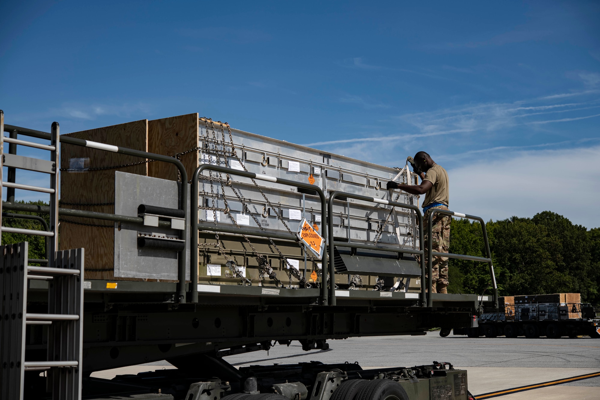 A Team Dover Airman loads weapons cargo bound for Ukraine onto a C-17 Globemaster III during a security assistance mission at Dover Air Force Base, Delaware, Sept. 14, 2022. The Department of Defense is working with industry to increase production of certain capabilities to continue meeting the needs of Ukrainian forces, while ensuring the U.S. is ready to defend itself, our partners and allies. (U.S. Air Force photo by Staff Sgt. Marco A. Gomez)