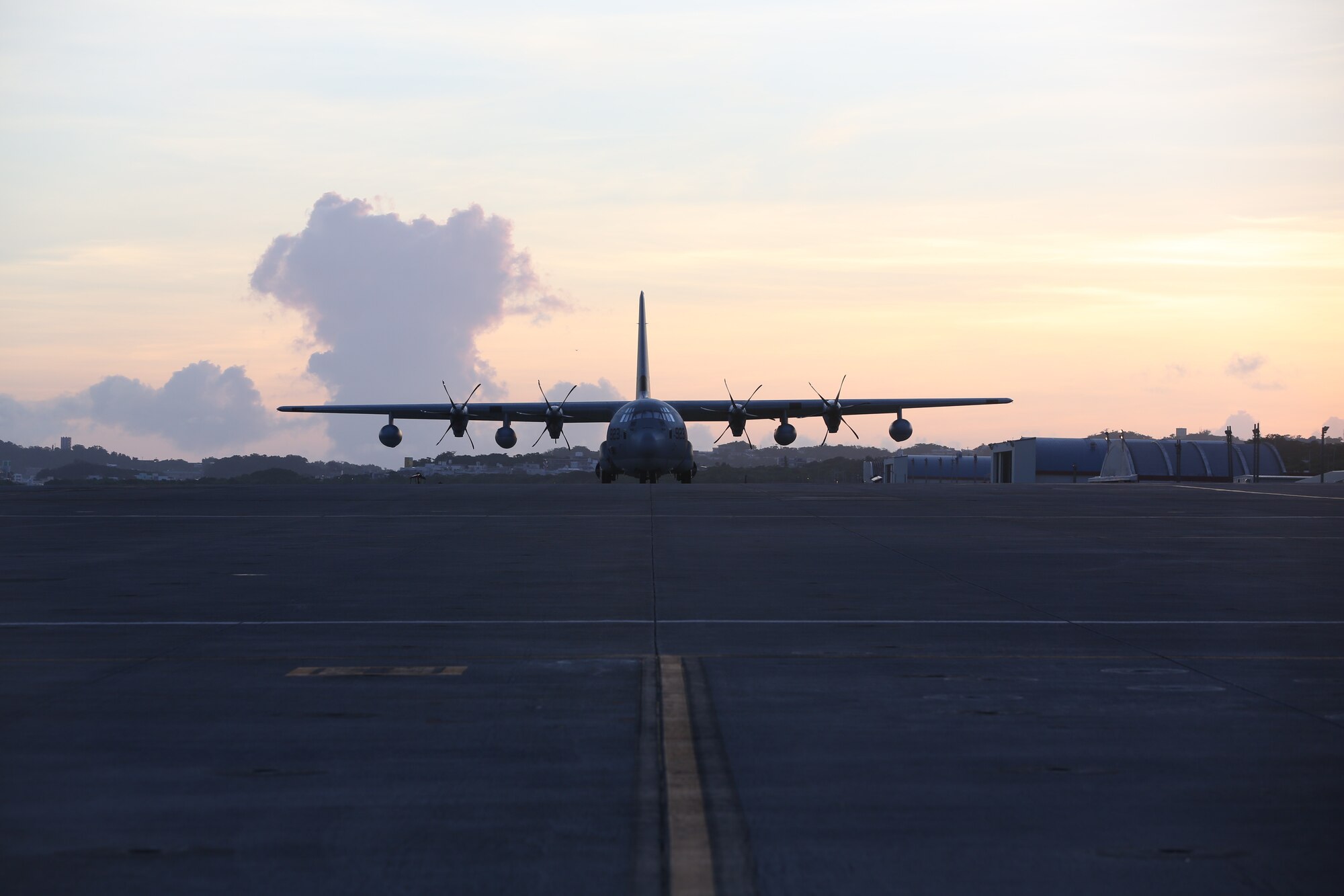 U.S. Marine Corps C-130 waits at Marine Corps Air Station Futenma, August 1, 2016. The C-130 is planned to transport a HIMAR to the Philippines for Phiblex 2016. (U.S. Marine Corps photo by Lance Cpl. Brooke Deiters/ Released)