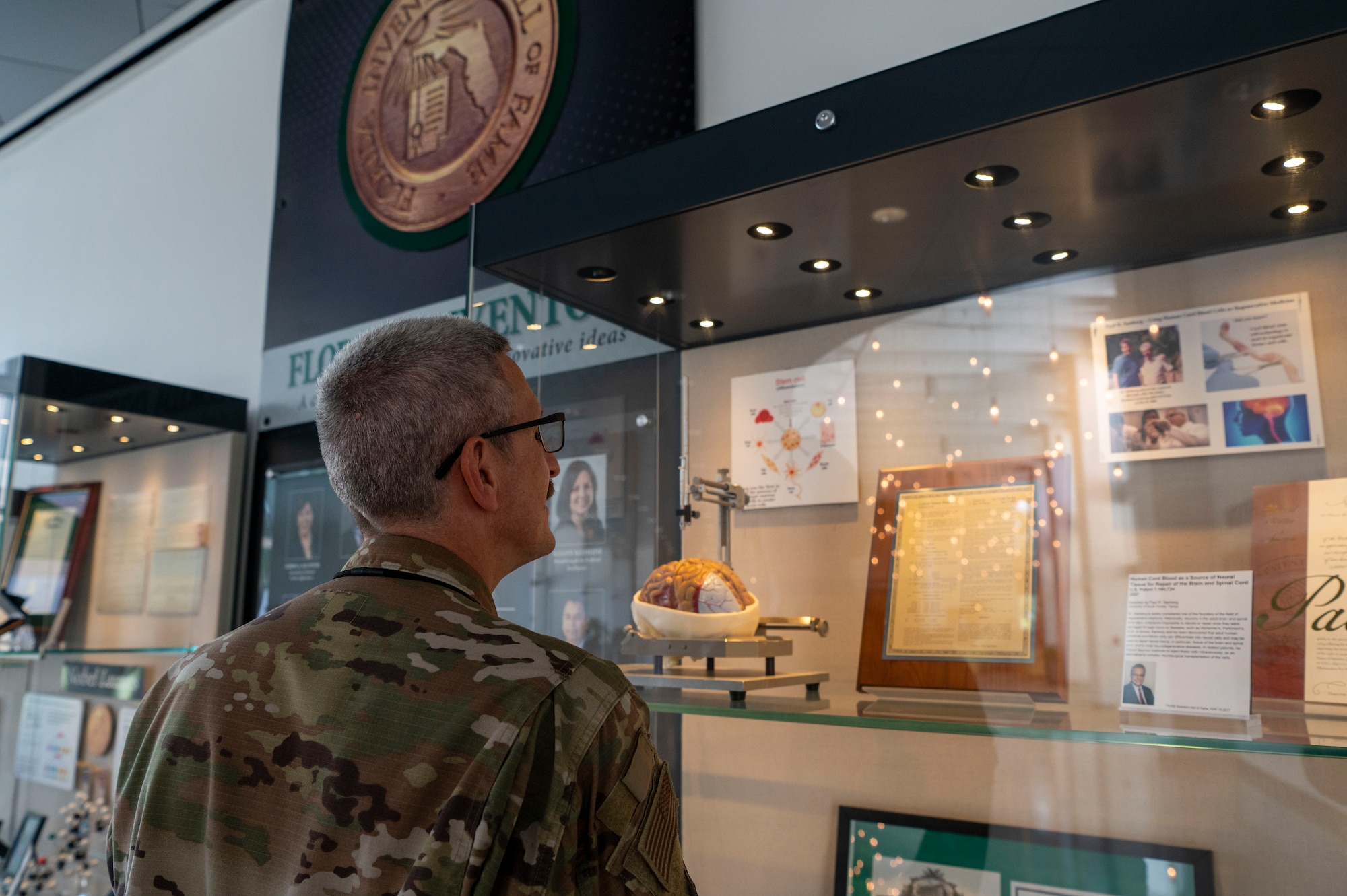 U.S. Air Force Col. Eric Schroeder, the 6th Medical Group commander, observes an invention at the University of South Florida Research Park, Tampa, FL, Sep. 16, 2022.