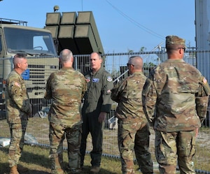 U.S. Air Force Lt. Gen. Kirk Pierce, Continental U.S. NORAD Region - 1st Air Force (Air Forces Northern and Air Forces Space) commander, discuss the capabilities of the Deployable-Integrated Air Defense System and National Advanced Surface-to-Air Missile System from members of the 263rd Army Air and Missile Defense Command, at Tyndall Air Force Base, Fla., Sept. 14, 2022. Air Force and Army air defense partners showcased enhancements meant to raise battlespace awareness through increasing threat identification allowing more time for leaders to make decisions.