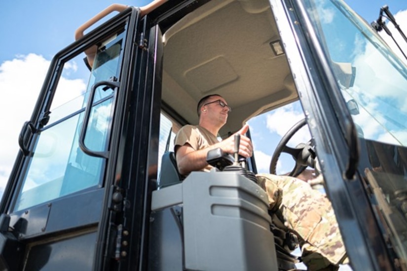 Man operates forklift