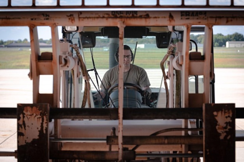 Man operates forklift