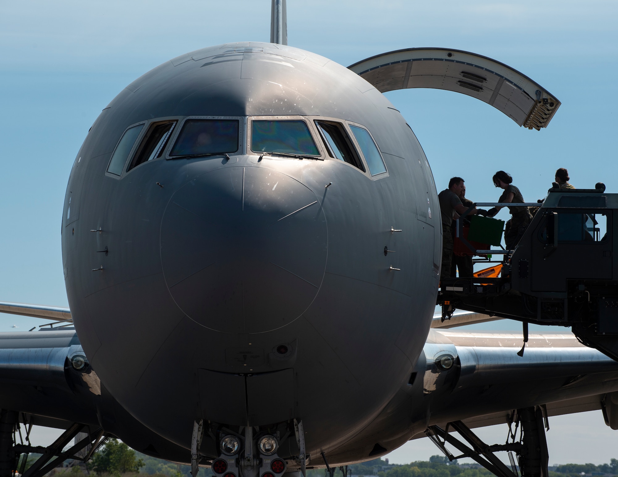 U.S. Air Force Master Sgt. Heather Boutin, center, 133rd Air Transportation Function, hands over equipment in St. Paul., Minn., Sept. 12, 2022