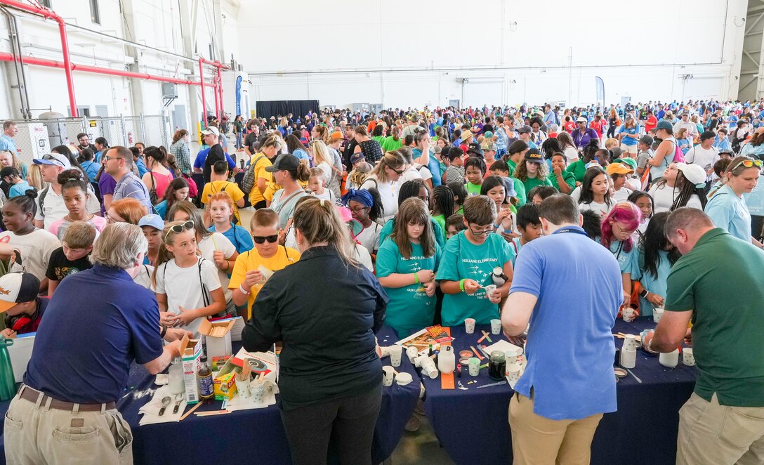 IMAGE: Thousands of Virginia Beach area fifth-graders took part in a field trip to the first day of the Naval Air Station Oceana Air Show. Scientists and engineers from Naval Surface Warfare Center Dahlgren Division Dam Neck Activity volunteered their time to staff a STEM station where the students could interact with robotics, homemade slime and a static electricity generator.