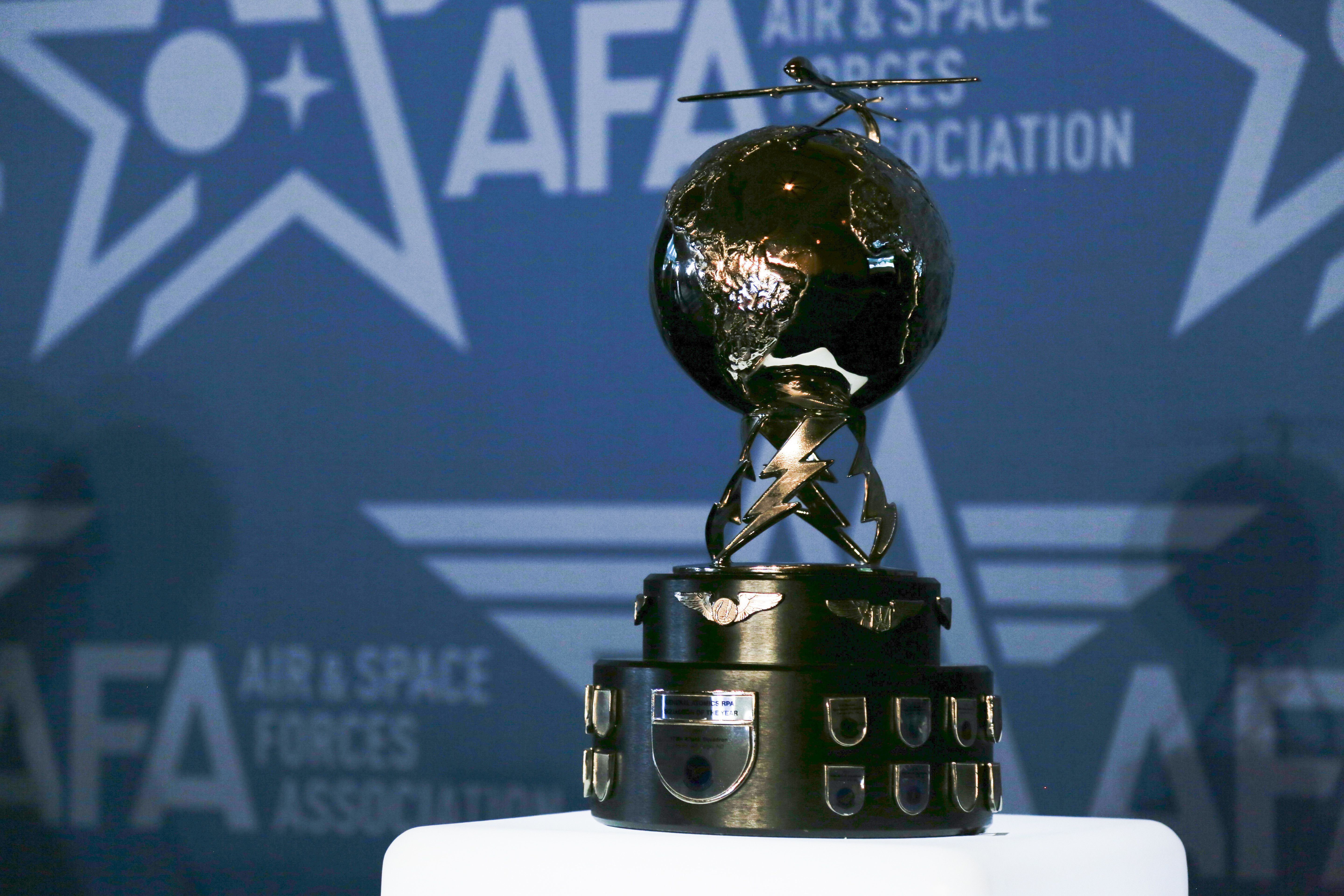 The 178th Attack Squadron, 119th Wing, North Dakota National Guard, is presented with the Mitchell Institute for Aerospace Studies’ General Atomics Remotely Piloted Aircraft (RPA) Squadron of the Year Trophy for 2021 at a ceremony during the 2022 Air and Space Forces Association’s Air, Space and Cyber Conference at the Gaylord National Harbor, National Harbor, Maryland, Sept. 19, 2022. The 178th is the first National Guard unit to earn this award which is presented annually for outstanding performance by RPA squadrons in achieving intelligence, surveillance, and persistent attack and reconnaissance over the preceding calendar year. (U.S. Army National Guard photo by Sgt. 1st Class Zach Sheely)