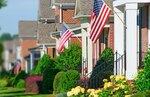 homes with American flags flying outside