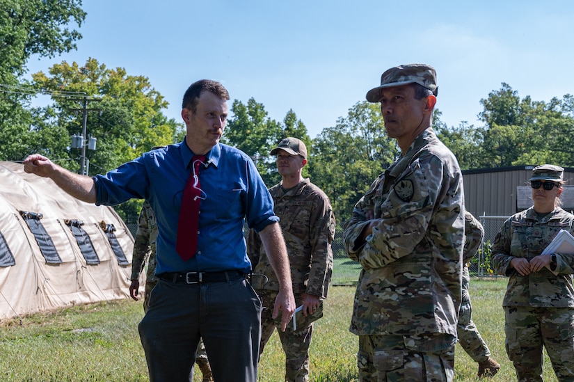 Christopher Carbone, Army Support Activity Medical Simulation Training Center course coordinator, left, gives a tour of the MSTC to U.S. Air Force Col. Col. Rudolph Cachuela, Air Mobility Command surgeon general, at Joint Base McGuire-Dix-Lakehurst, N.J., Sept. 22, 2022.
