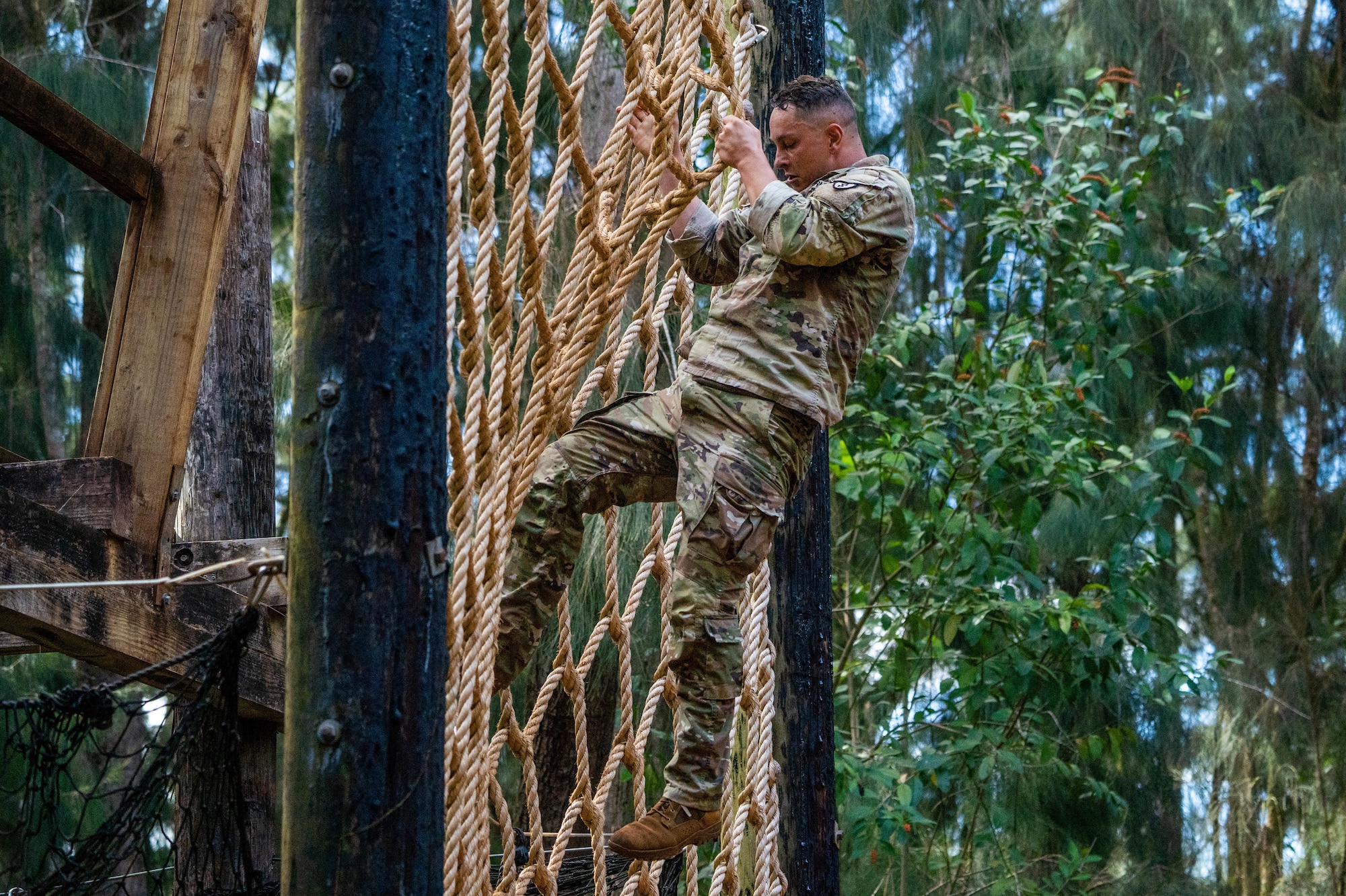 U.S. Army 2nd Lt. John Jennings, 3rd Battalion, 7th Field Artillery, 25th Infantry Division, completes an obstacle course during Chaos Challenge 2022 at Lightning Academy, Hawaii, Aug. 13, 2022. The multi-day competition consisted of competitors from the 3rd, 5th and 25th Air Support Operations Squadron, with guest teams from the 647th Security Forces Squadron and 7th Field Artillery, 25th Infantry Division. (U.S. Air Force photo by Senior Airman Makensie Cooper)