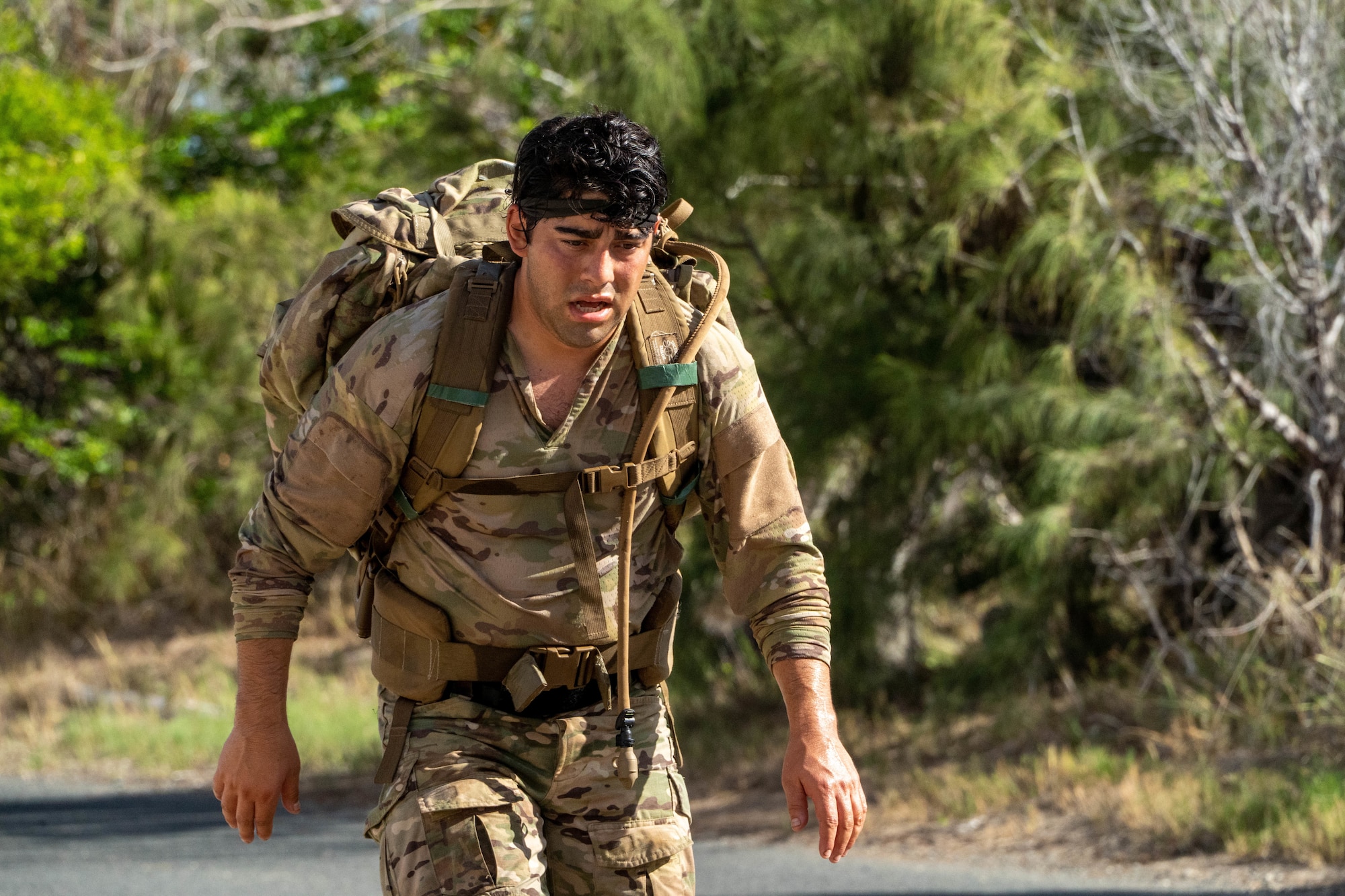 U.S. Air Force Staff Sgt. Jordan Falcon, 3rd Air Support Operations Squadron Detachment 1 tactical air control party specialist, completes a four-mile ruck during the last day of Chaos Challenge 2022 at Bellows Air Station, Aug. 15, 2022. The event was a multi-day series of mental and physical challenges hosted by the 25th Air Support Operations Squadron. (U.S. Air Force photo by Senior Airman Makensie Cooper)