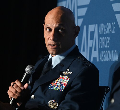 gen robinson holds microphone