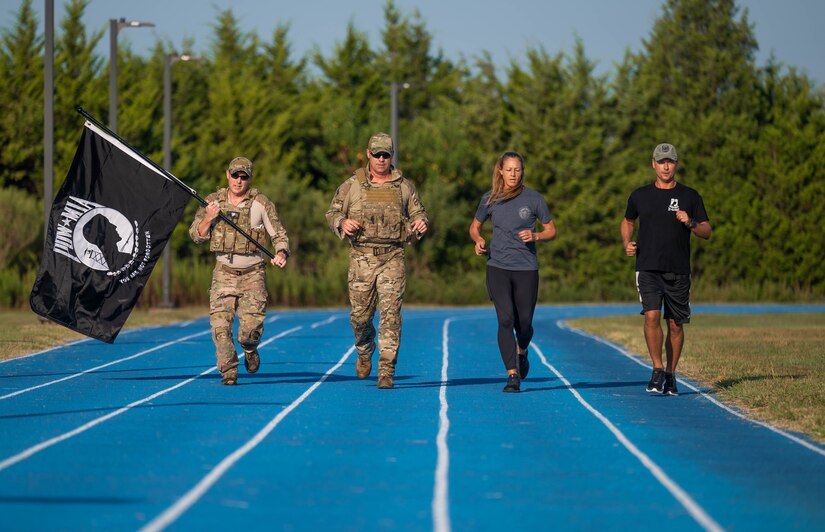 Members of the Joint Base Langley-Eustis Chief’s Group run to commemorate the National POW/MIA Recognition Day at JBLE, Virginia, Sept. 15, 2022.