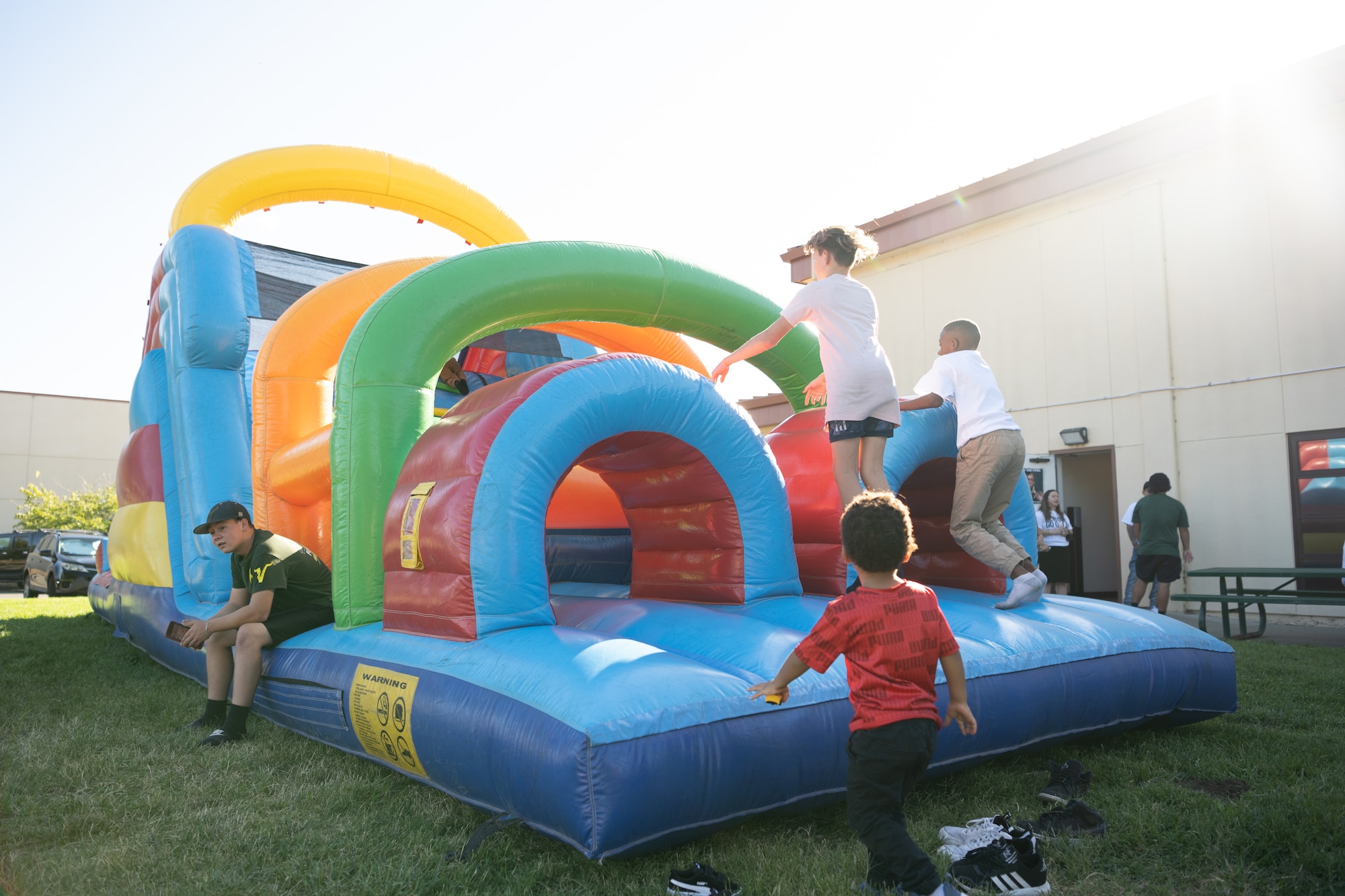 children playing in a bouncy house