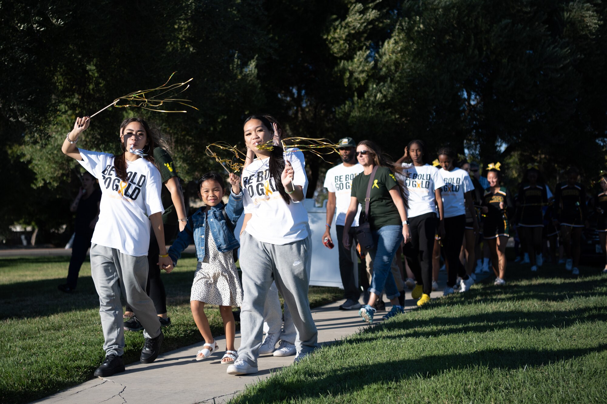 families walking for cancer awareness event