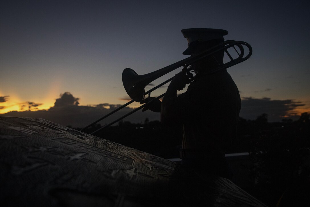 U.S. Marine Corps Lance Cpl. Scott  Vanderbilt, a brass quartet trombone player for the 1st Marine Division Band, performs during the anniversary of the Battle of Guadalcanal at the Guadalcanal American Memorial in the Solomon Islands, Aug. 7, 2022. The ceremony commemorated the 80th anniversary of the battle, and served to honor the fallen and strengthen the U.S. relationship with the Solomon Islands and other Pacific allies and partners. The historic battle was codenamed Operation Watchtower and was the first major offensive and decisive victory for the allied forces in the Pacific theater. (U.S. Marine Corps photo by Cpl. Dillon L. Buck)