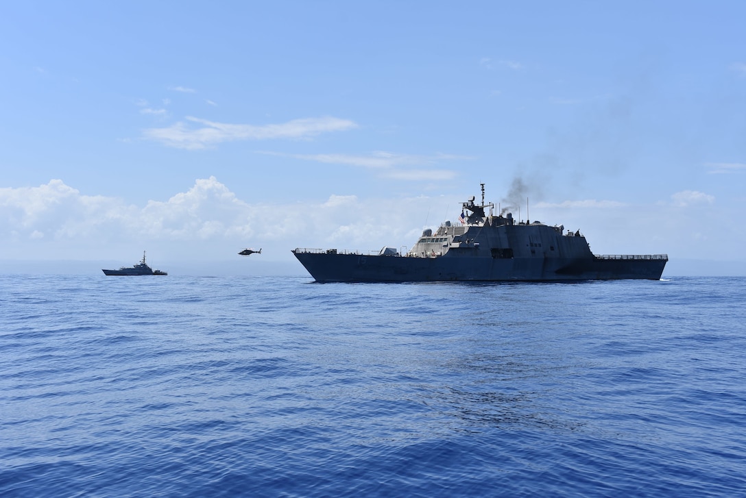 The Freedom-variant littoral combat ship USS Billings (LCS 15) and Her Majesty’s Jamaican Ship (HMJS) Alexander Bustamante along with a helicopter assigned to the Jamaican Defense Force (JDF) participate in a photo exercise offshore of Ocho Rios, Jamaica, Sept. 19, 2022. Billings is deployed to the U.S. 4th Fleet area of operations to support Joint Interagency Task Force South’s mission, which includes counter-illicit drug trafficking missions in the Caribbean and Eastern Pacific.