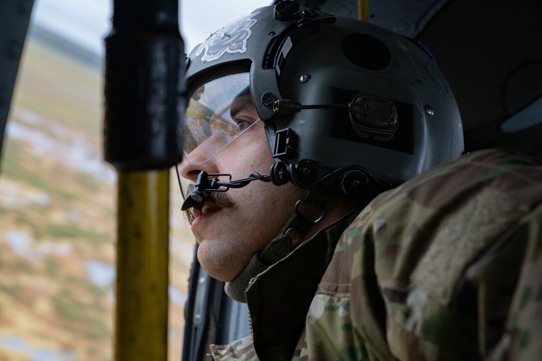 Photo of a Guardsman conducting a rescue mission