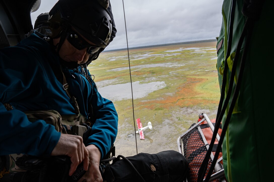 Photo of a Guardsman conducting a rescue mission