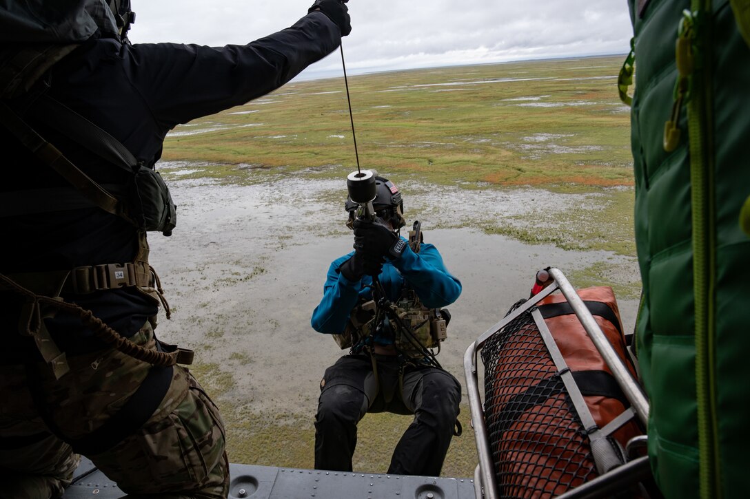Photo of a Guardsman conducting a rescue mission