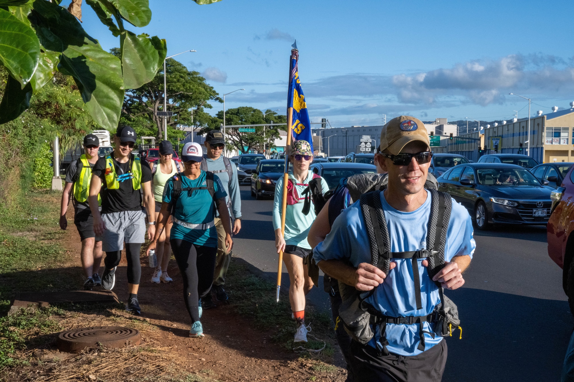 Members from the 692nd Intelligence, Surveillance and Reconnaissance Group trek around the Island of Oahu, Aug. 11, 2022. The ISRG resiliency team set out to complete the 138-mile trek for resiliency for the third year in a row. (U.S. Air Force photo by Senior Airman Makensie Cooper)