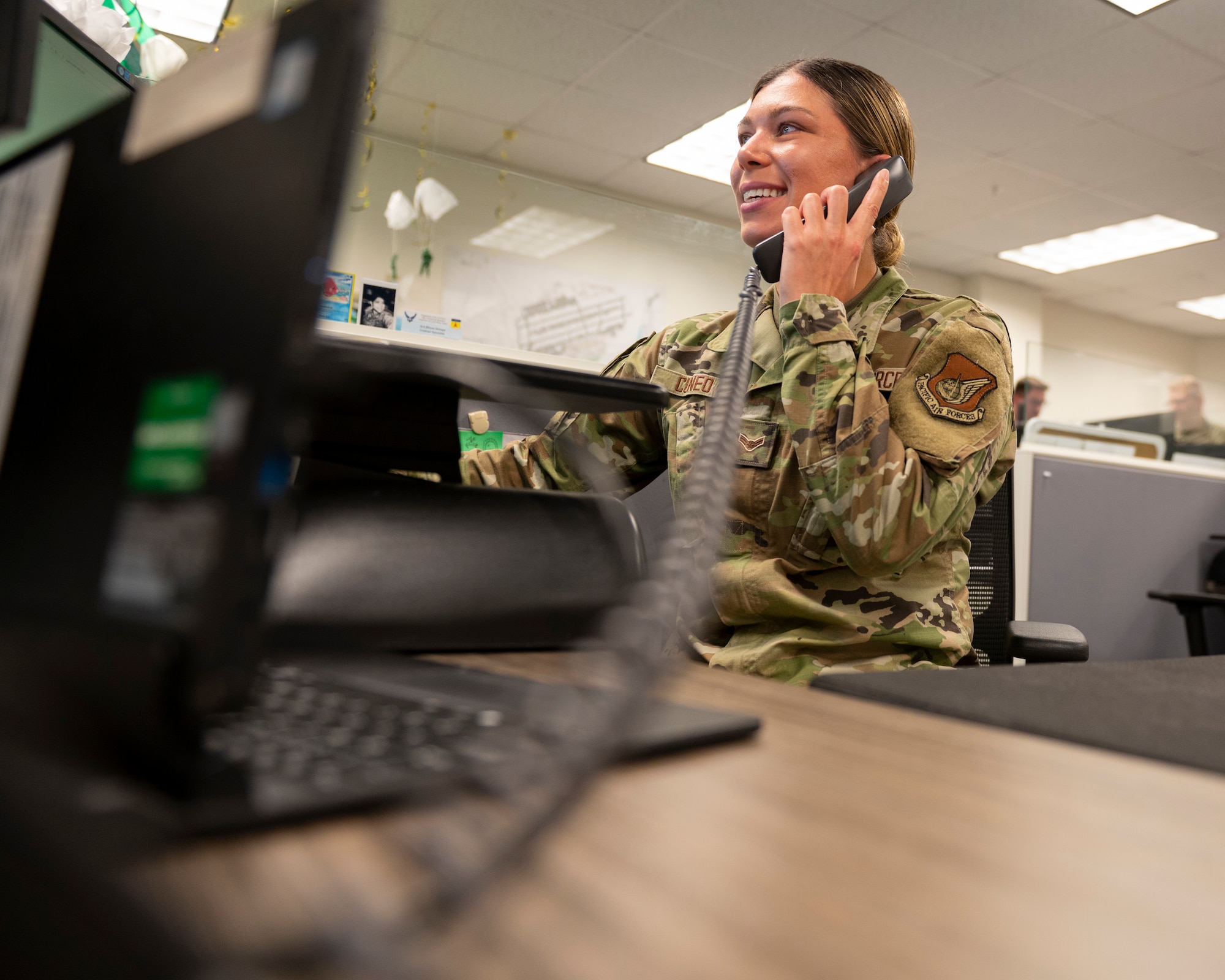 U.S. Air Force Airman 1st Class Liel Cuneo, 36th Contracting Squadron contracting specialist, answers a phone call from a customer on Andersen Air Force Base, Aug. 23, 2022. Contracting specialists assist contracting officers in purchasing acquisitions by doing market research and making sure it complies with the Federal Acquisitions Regulation. (U.S. Air Force photo by Airman Spencer Perkins)