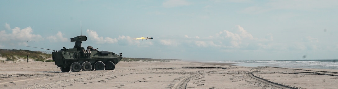 U.S. Marines with 2nd Light Armored Reconnaissance Battalion, 2d Marine Division, fire a TOW missile system over water on Camp Lejeune, North Carolina, Sept. 19, 2022. In order to enhance the Marine Corps’ capability to control littoral areas with a reduced footprint, 2d LAR facilitated the employment of a TOW missile fired from a LAV-AT utilizing a radio frequency signal between the launch tube and missile. (U.S. Marine Corps photo by Lance Cpl. Emma Gray)