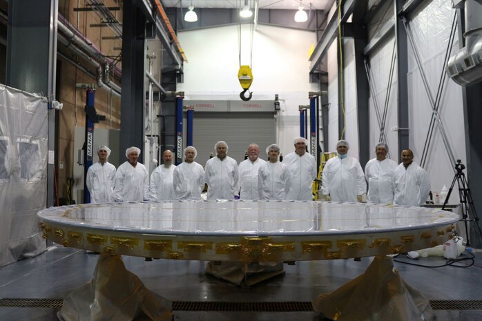 The Boeing team poses with the Advanced Electro-Optical System, or AEOS, primary mirror following a recoat at the Air Force Maui Optical and Supercomputing (AMOS) site, Maui, Hawaii. This was the second recoat of the mirror since AEOS’s initial installation in 1997. AMOS is part of the Air Force Research Laboratory, and the 3.6-meter AEOS telescope supports the U.S. Space Force’s space domain awareness mission. (Courtesy photo / Boeing)