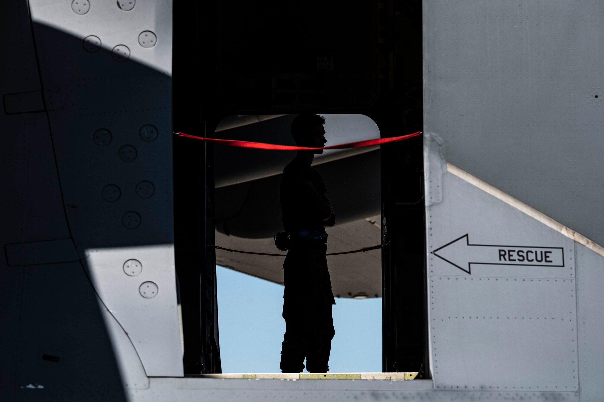 A Team Dover Airman observes weapons cargo being loaded onto a C-17 Globemaster III during a security assistance mission at Dover Air Force Base, Delaware, Sept. 14, 2022. The Department of Defense is working with industry to increase production of certain capabilities to continue meeting the needs of Ukrainian forces, while ensuring the U.S. is ready to defend itself, our partners and allies. (U.S. Air Force photo by Staff Sgt. Marco A. Gomez)