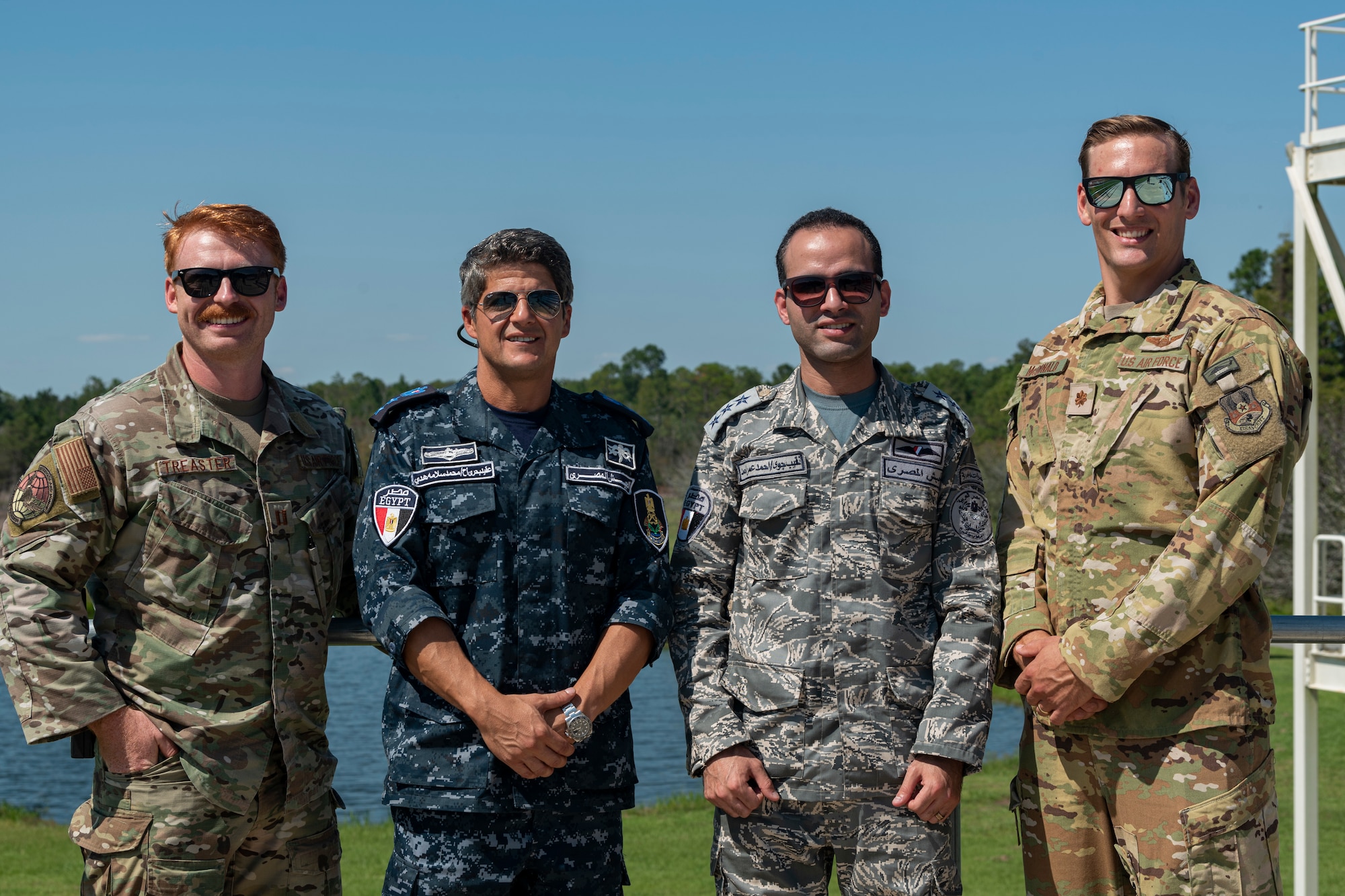 U.S. Air Force Airmen assigned to the 38th Rescue Squadron pose for a photo with Egyptian Navy and Air Force members during a combat search and rescue subject matter expert exchange at Moody Air Force Base, Georgia, Sept. 15, 2022. Egypt and the United States share a strategic security relationship, which plays a leading role in regional security and efforts to combat the spread of extremism. Engagements such as this ensure that the security relationship is not only forged at the strategic level but also the tactical and operational levels, creating a cohesive, layered approach to creating a safe and stable theater. (U.S. Air Force photo by Senior Airman Jasmine M. Barnes)