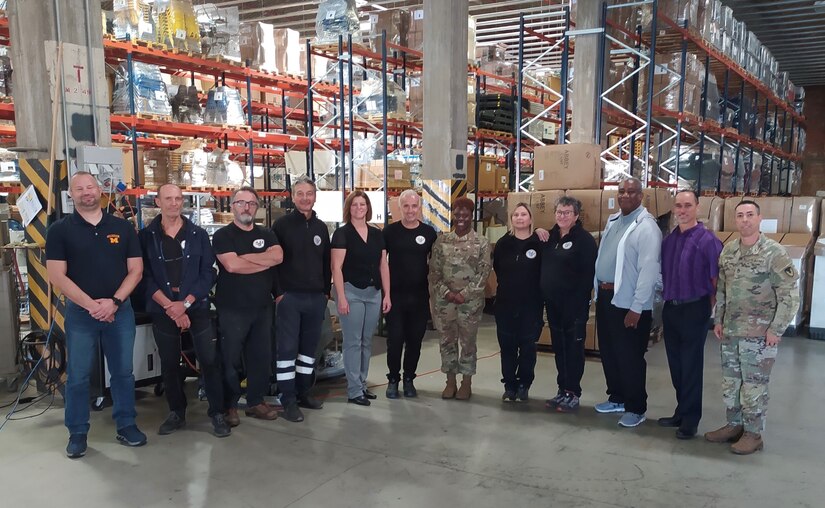 The commander of the 405th Army Field Support Brigade made a site visit to the Humanitarian Assistance Program team in Livorno, Sept. 22. Pictured here, Col. Crystal Hills poses for a photo with the Livorno HAP team. (Courtesy photo)