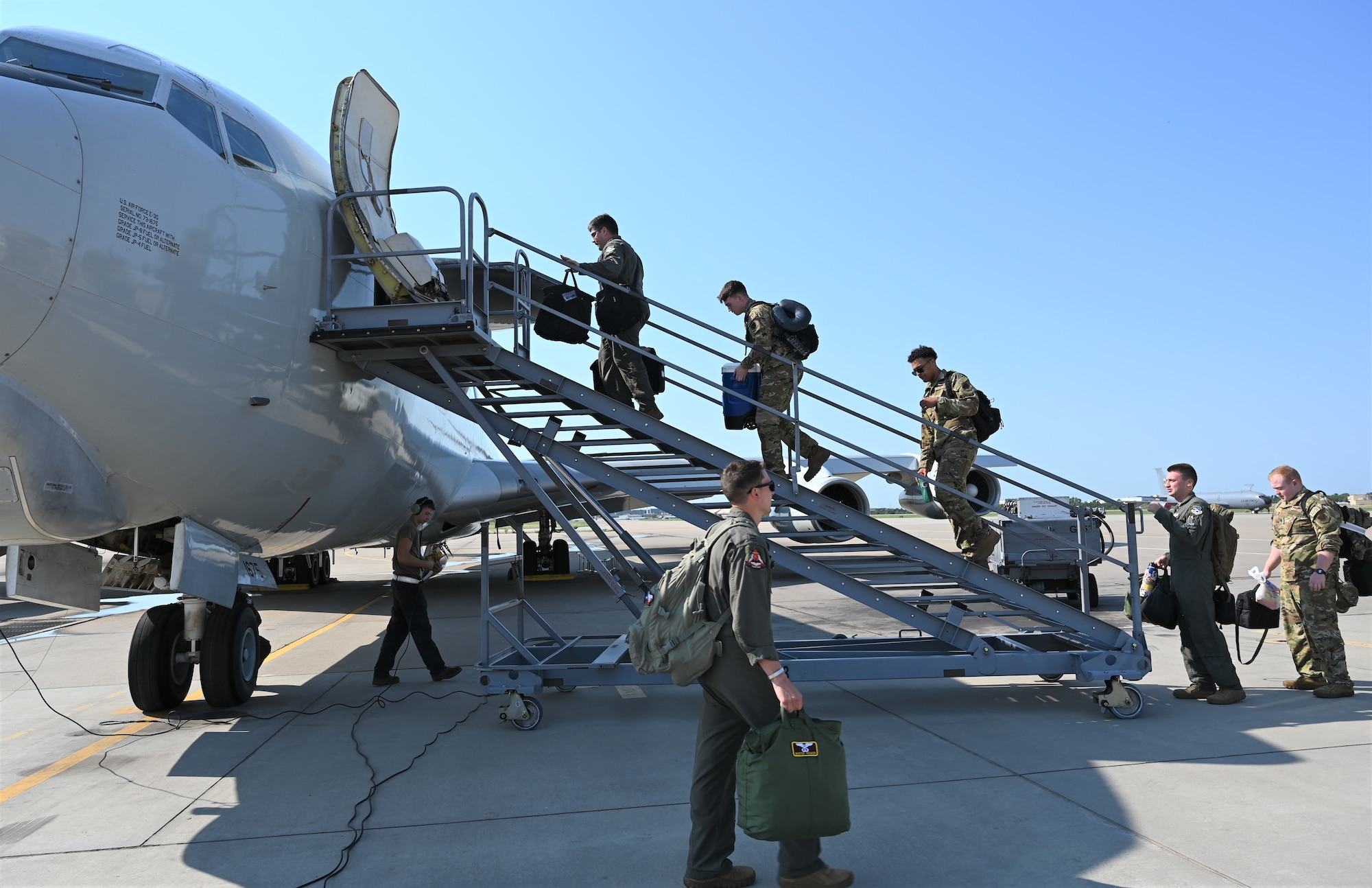 crew members boarding jet