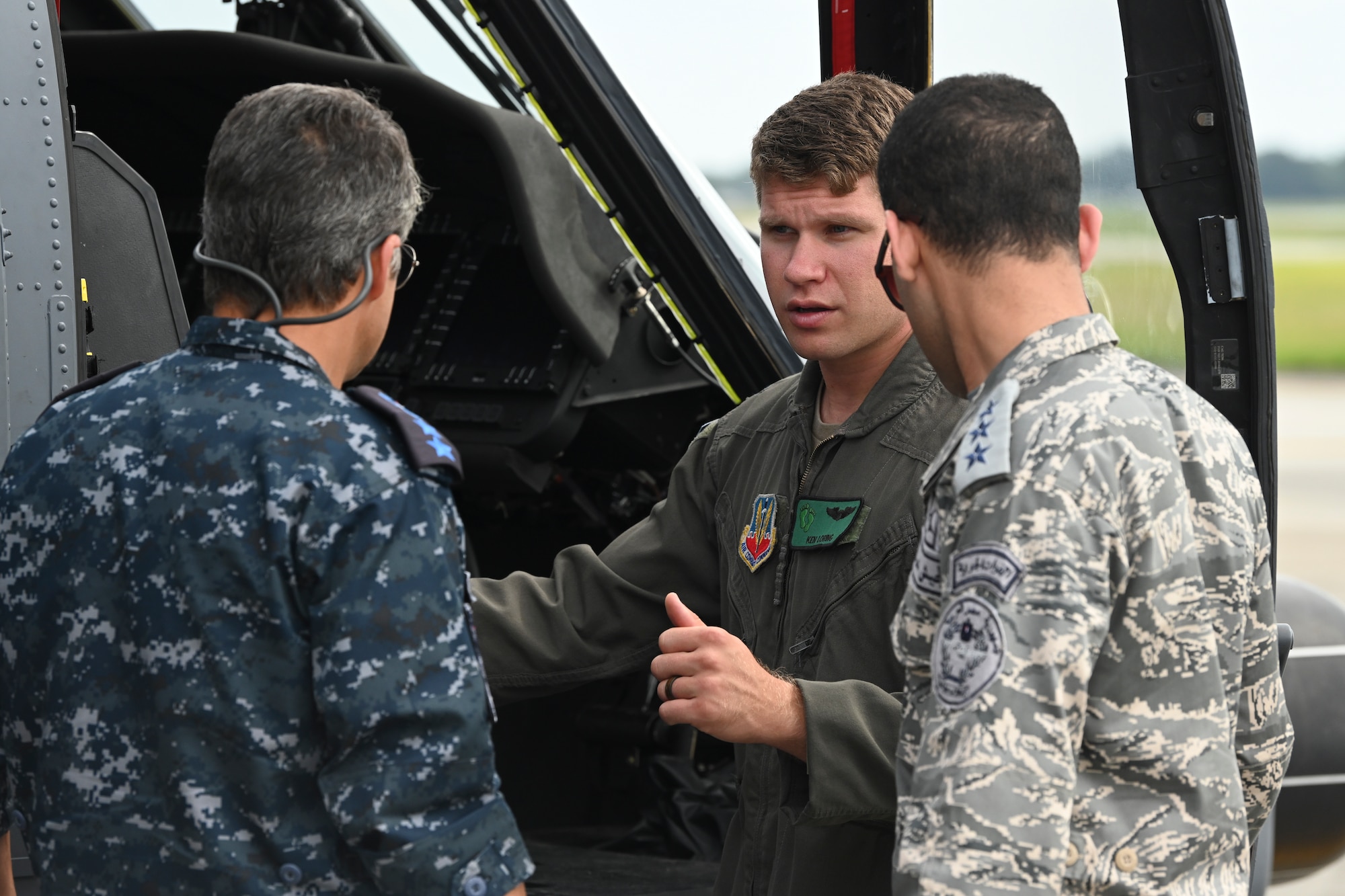 U.S. Air Force Capt. Kenneth Reyesloring, 41st Rescue Squadron HH-60W Jolly Green II pilot, converses with members of Egypt’s Air Force and Navy during a CSAR subject matter expert exchange at Moody Air Force Base, Georgia, Sept. 13, 2022. Egypt and the United States share a strategic security relationship, which plays a leading role in regional security and efforts to combat the spread of extremism. Engagements such as this ensure that the security relationship is not only forged at the strategic level but also the tactical and operational levels, creating a cohesive, layered approach to creating a safe and stable theater. (U.S. Air Force photo by Airman 1st Class Rachel Coates)