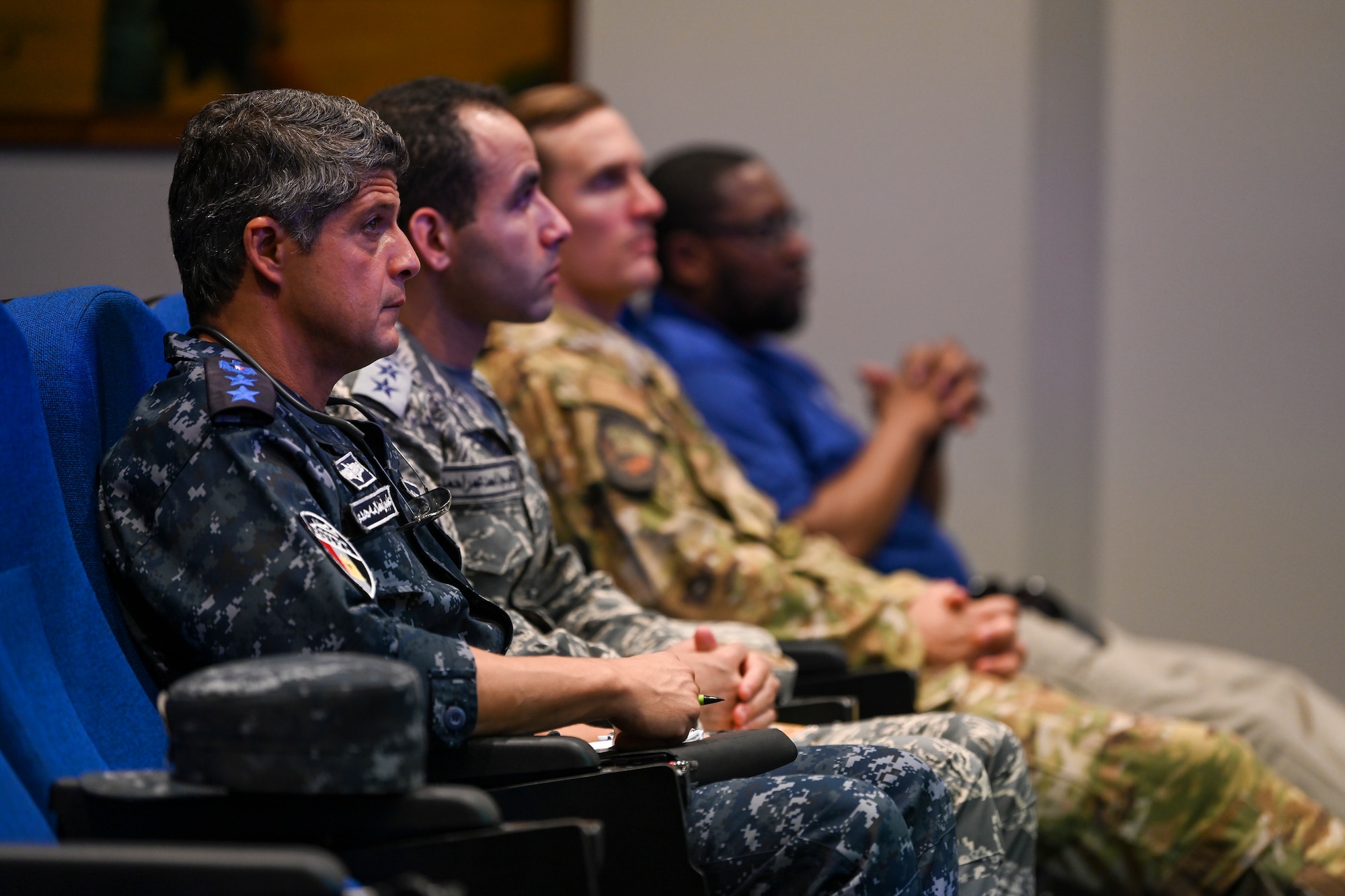 An Egyptian Air Force and Navy member sit in a brief at the 71st Rescue Squadron, during a CSAR subject matter expert exchange at Moody Air Force Base, Georgia, Sept. 13, 2022. Egypt and the United States share a strategic security relationship, which plays a leading role in regional security and efforts to combat the spread of extremism. Engagements such as this ensure that the security relationship is not only forged at the strategic level but also the tactical and operational levels, creating a cohesive, layered approach to creating a safe and stable theater. (U.S. Air Force photo by Airman 1st Class Rachel Coates)