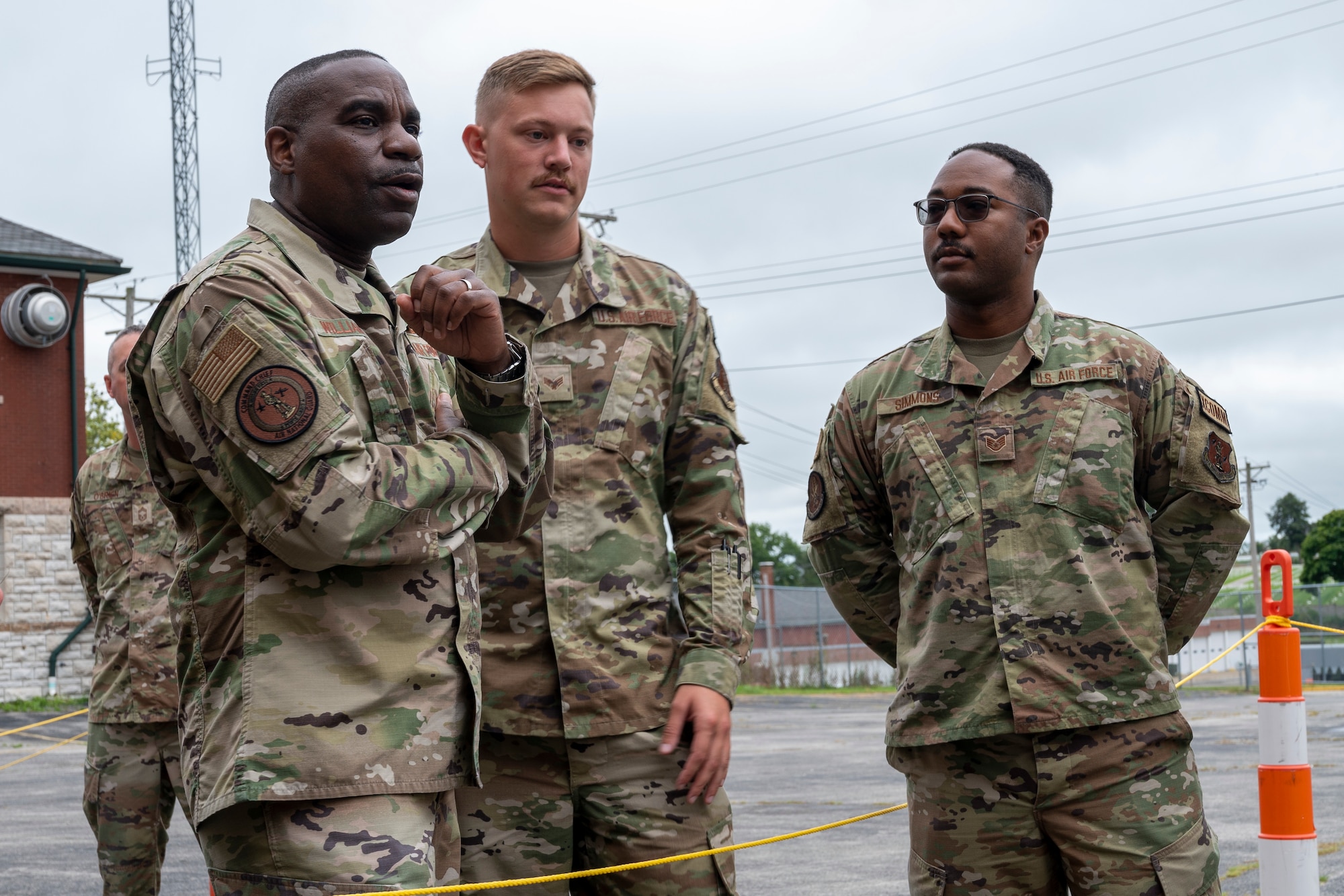 U.S. Air Force Chief Master Sgt. Maurice Williams, right, command chief, Air National Guard, speaks with Senior Airman Jaxson Ziemann and Staff Sgt. Jerone Simmons, both assigned to the 239th Combat Communications Squadron, 131st Bomb Wing, Missouri National Guard at Jefferson Barracks Air National Guard Base, St. Louis, Missouri, Sept. 11, 2022. During his visit, Williams spoke with leadership and Airmen about the importance of the mission, leadership qualities and the Airmen's impact on the future of the Air Force. (U.S. Air National Guard photo by Senior Airman Whitney Erhart)