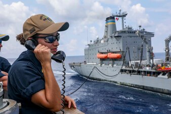 USS Higgins (DDG 76) conducts a replenishment-at-sea with USNS Big Horn (T-AO 198) in the South China Sea.