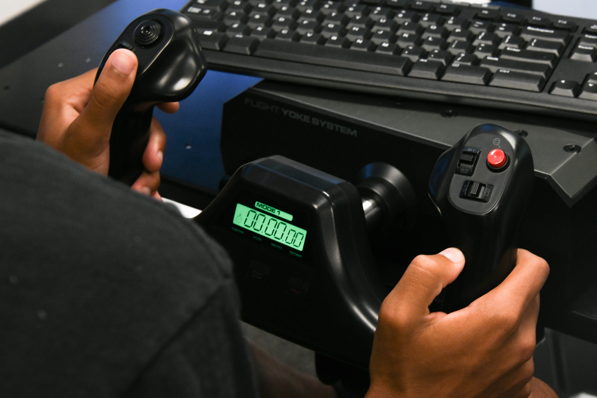 A high school student controls an X-Plane 11 simulator as part of a science, technology, engineering and math curriculum at Altus High School, Altus, Oklahoma, Sept. 21, 2022.  The curriculum is designed to give students a clear understanding of career opportunities in piloting. (U.S. Air Force photo by Airman 1st Class Miyah Gray)