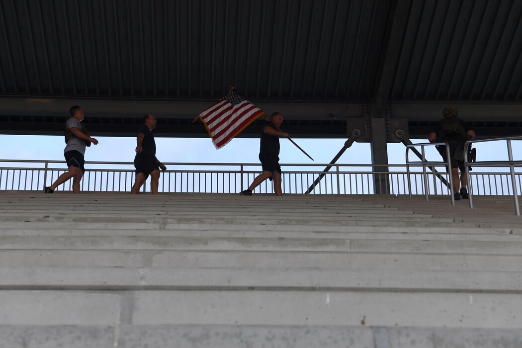 Members from the 433rd Civil Engineer Squadron participate in a 9/11 memorial stair climb at Joint Base San Antonio-Lackland, Texas, Sept. 11, 2022. The 433rd CES performs a stair climb every year to commemorate the 110 flights of stairs first responders had to climb inside the World Trade Center on Sept. 11, 2001. (U.S. Air Force photo by Staff Sgt. Adriana Barrientos)