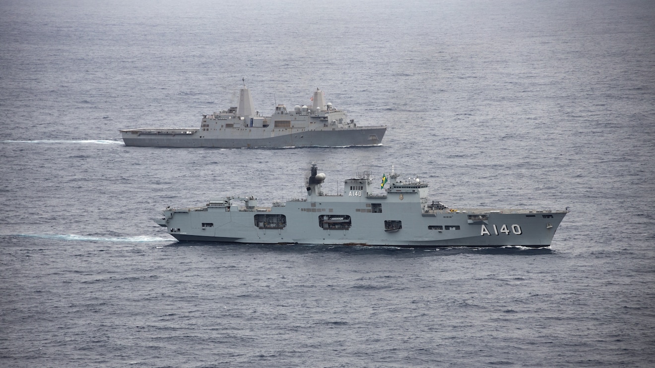 ATLANTIC OCEAN (Sept. 11, 2022) The Brazilian amphibious assault ship PHM Atlântico (A 140), front, maneuvers past the amphibious transport dock ship USS Mesa Verde (LPD 19) while conducting bi-lateral naval operations during exercise UNITAS LXIII, Sept. 11, 2022.