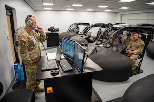 U.S. Army Staff Sgt. Montana Matthew Ellis, Charlie Company, 1-210th Aviation Regiment, 15N Avionics Mechanic Instructor, provides instruction to students during hands-on training class at Joint Base Langley-Eustis, Virginia, September 12, 2022. Students assigned to the avionics mechanics schoolhouse learn general subjects, improved basic electronics training, data networking, communications, navigation systems, automatic flight control systems, and aircraft survivability equipment prior to reporting to their first duty assignment. (U.S. Air Force Photo by Abraham Essenmacher)