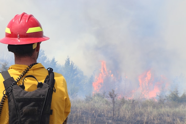 A member of the U.S. Army Corps of Engineers, Kansas City District staff helps conduct a prescribed fire to help conserve wildlife and ecosystems at Kanopolis lake on July 24, 2020. Photo by Ryan Williams, Kanopolis Lake natural resource manager.